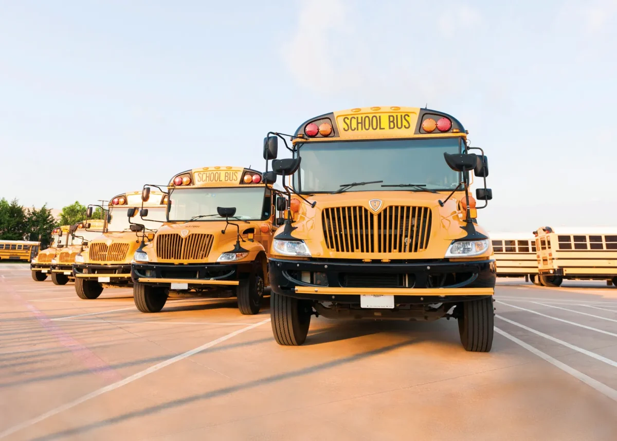 Buses lined up in parking lot